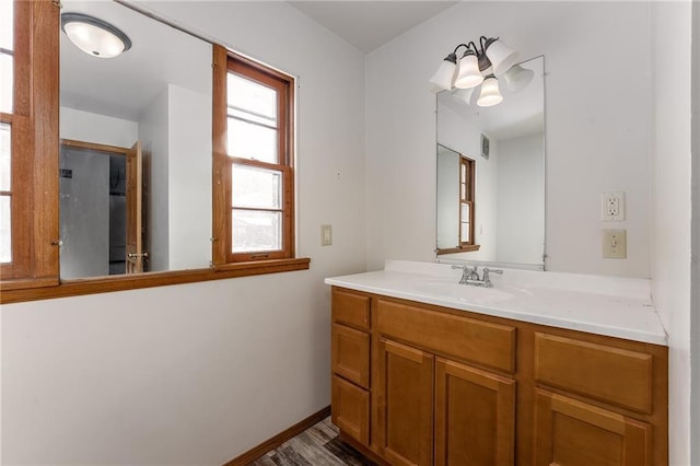 bathroom with ceiling fan and vanity