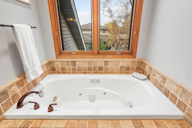 bathroom featuring tiled tub