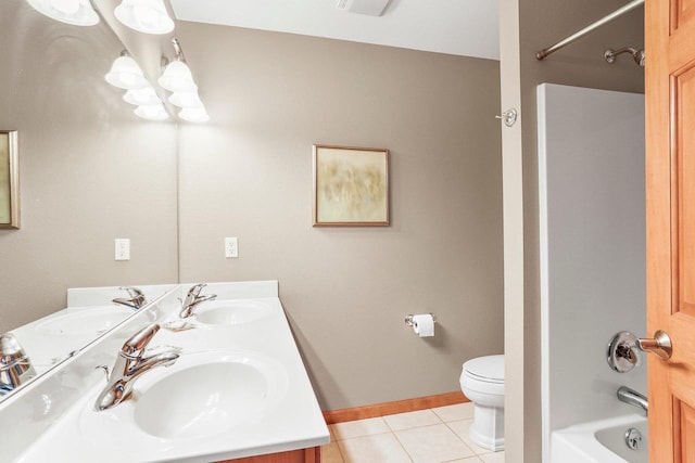 full bathroom featuring toilet, vanity, tile patterned floors, and bathtub / shower combination