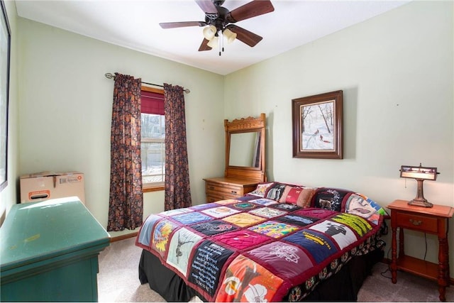 bedroom with ceiling fan and light colored carpet