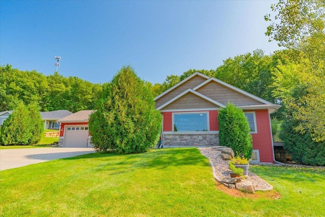 view of front facade with a front yard and a garage