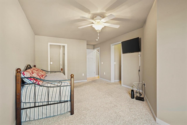 bedroom with light carpet and ceiling fan