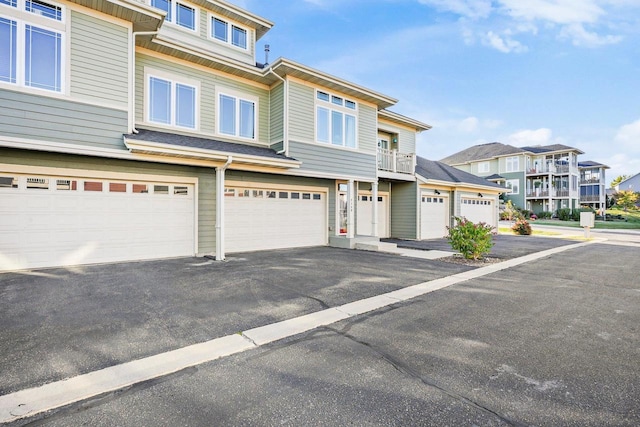 townhome / multi-family property featuring a garage