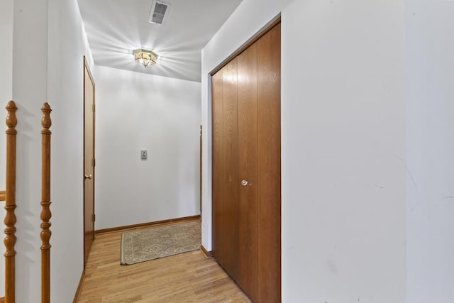 corridor featuring light hardwood / wood-style flooring