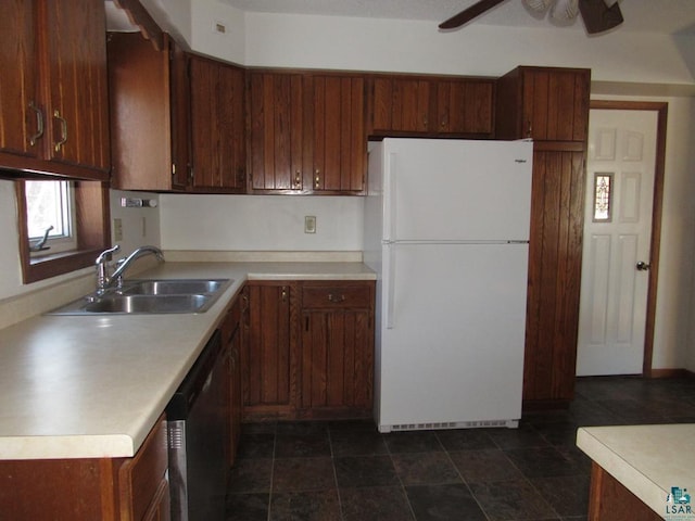 kitchen with sink, white refrigerator, stainless steel dishwasher, and ceiling fan