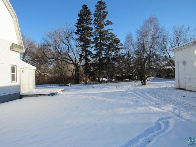 view of yard covered in snow