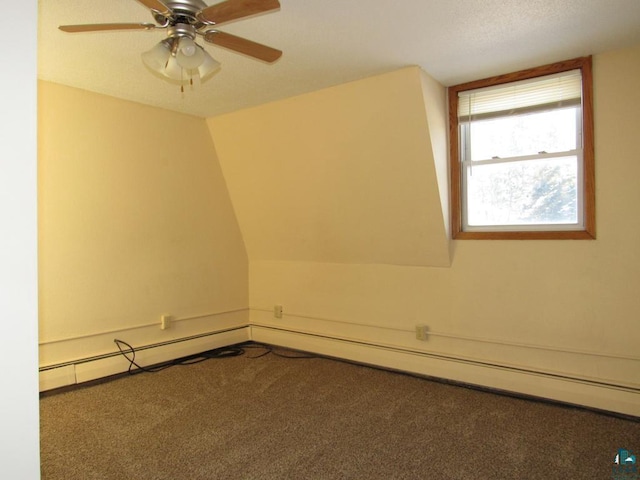 bonus room featuring lofted ceiling, baseboard heating, ceiling fan, and carpet