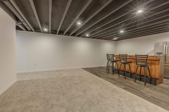 interior space with stainless steel refrigerator and wood counters