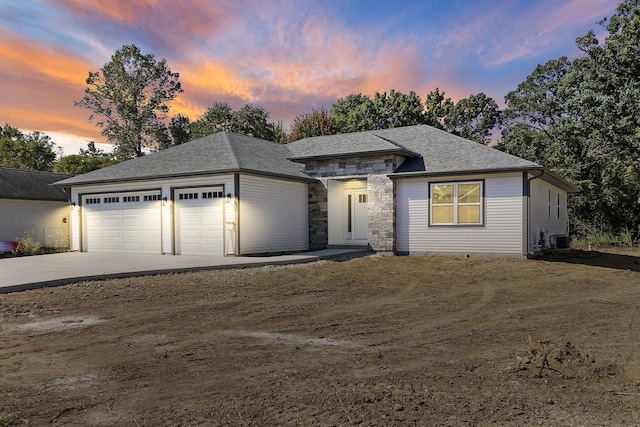 prairie-style home featuring a garage