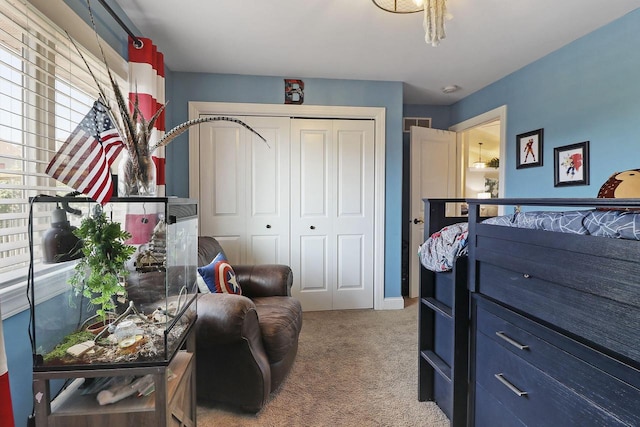 bedroom with a closet and carpet