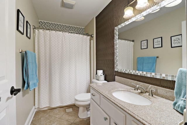 bathroom with curtained shower, tile patterned flooring, vanity, and toilet