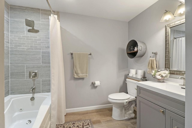 full bathroom featuring toilet, wood-type flooring, vanity, and shower / tub combo with curtain