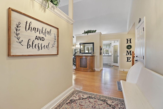 corridor with hardwood / wood-style flooring