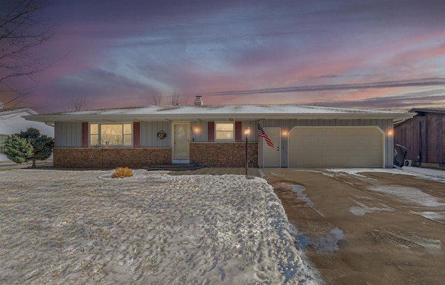 ranch-style house featuring a garage