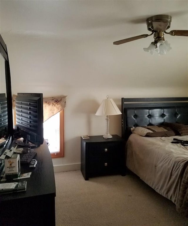 bedroom with ceiling fan and light carpet