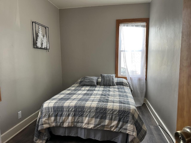 bedroom featuring dark hardwood / wood-style floors