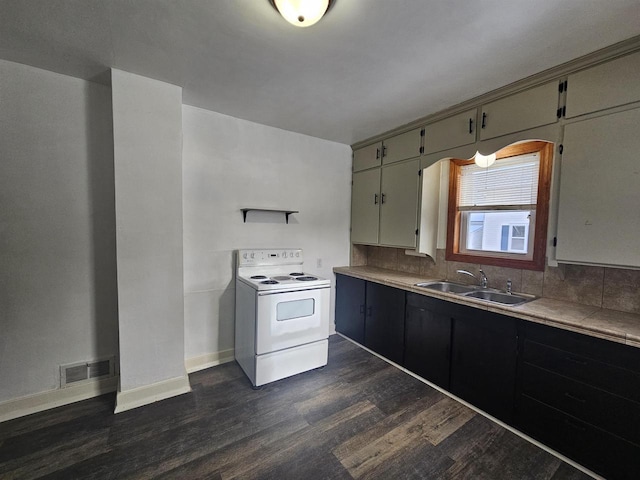 kitchen with white electric stove, tasteful backsplash, sink, and dark hardwood / wood-style flooring