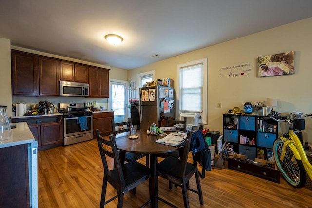 dining room with light hardwood / wood-style floors