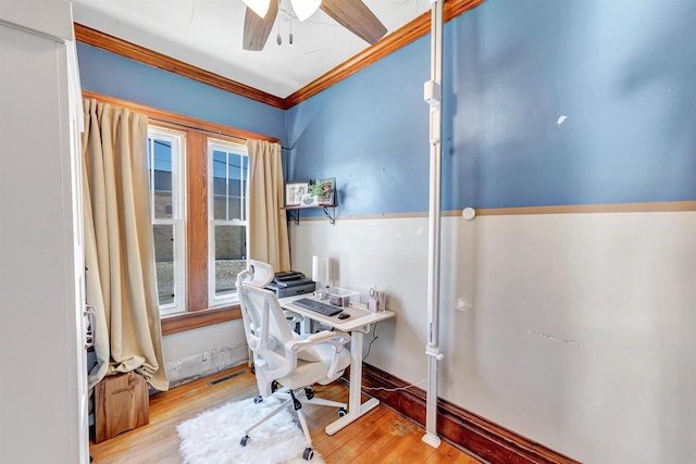 office space featuring light wood-type flooring, ceiling fan, and ornamental molding