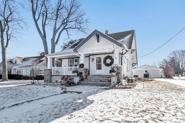 bungalow-style house with a garage and a porch