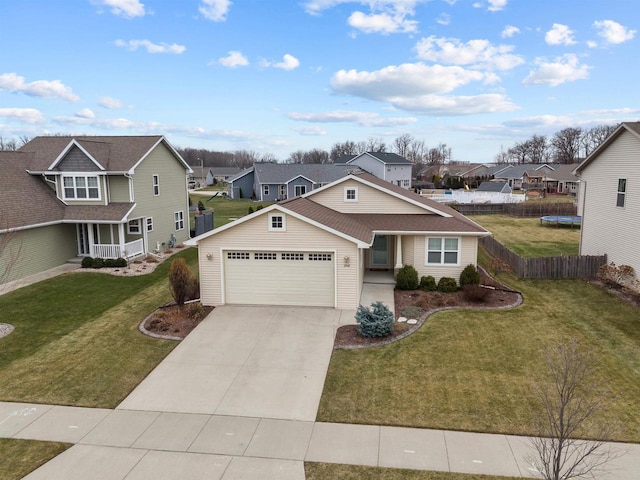 view of front of home with a garage and a front lawn