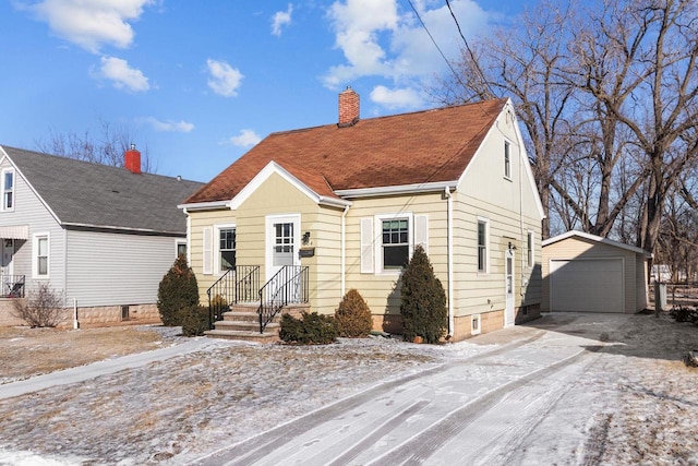 view of front of house with a garage and an outdoor structure