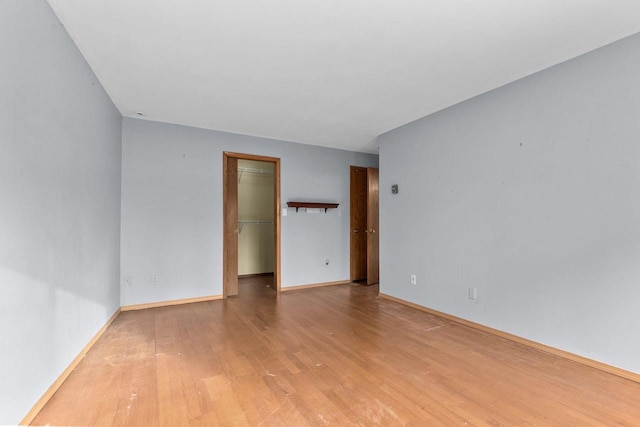 empty room with light hardwood / wood-style floors