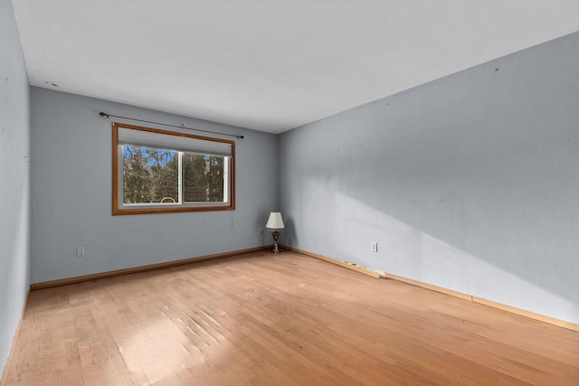 spare room with light hardwood / wood-style floors