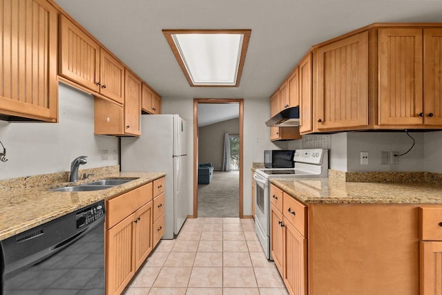 kitchen with sink, vaulted ceiling, white appliances, light stone countertops, and light colored carpet