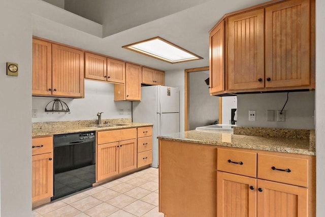 kitchen with light stone countertops, white fridge, light tile patterned flooring, black dishwasher, and sink