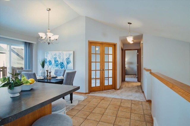 office with lofted ceiling, french doors, and a chandelier