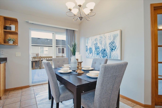 tiled dining area featuring lofted ceiling and a notable chandelier