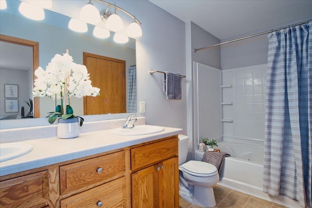 full bathroom featuring toilet, shower / bath combination with curtain, and vanity