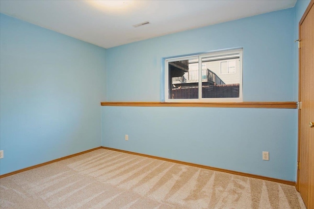 empty room with carpet flooring