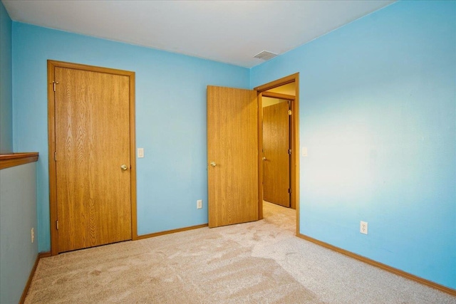 unfurnished bedroom with light carpet