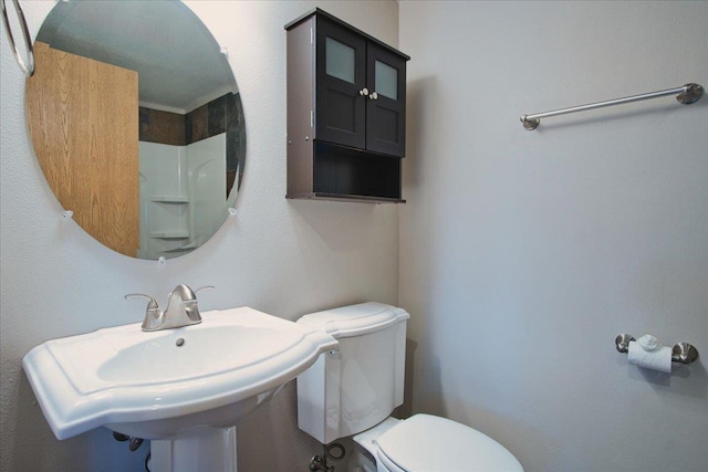 bathroom featuring sink and toilet