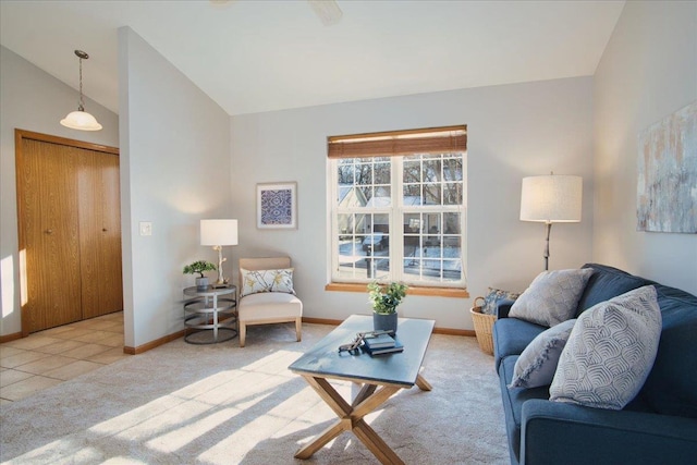 living room featuring lofted ceiling and light tile patterned floors