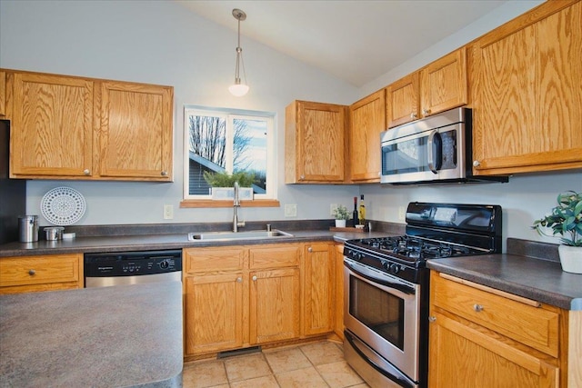 kitchen with stainless steel appliances, light tile patterned floors, pendant lighting, sink, and lofted ceiling