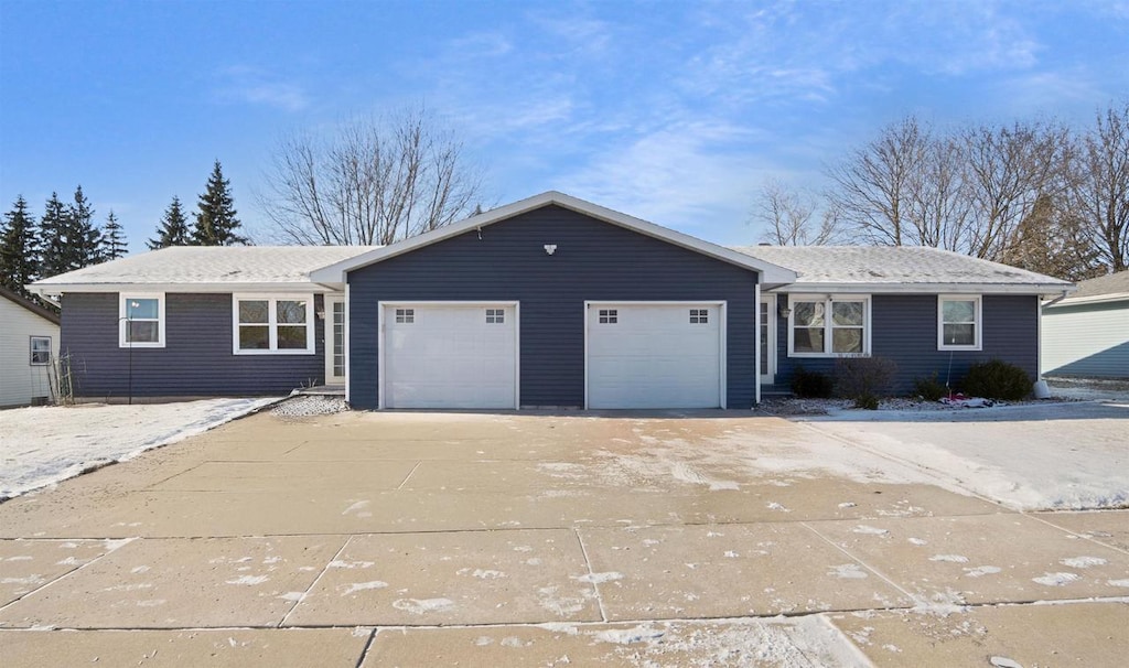 single story home featuring a garage