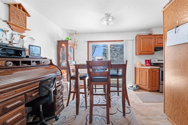 dining space with light wood-type flooring