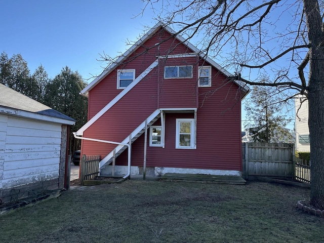 rear view of house with a lawn