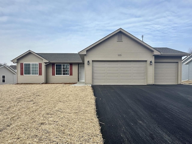 single story home with a garage