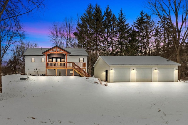 modern farmhouse style home with covered porch and a garage