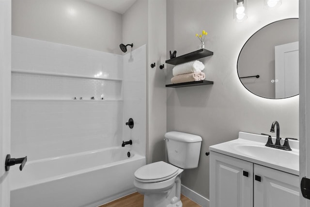 full bathroom with toilet, wood-type flooring, vanity, and shower / tub combination