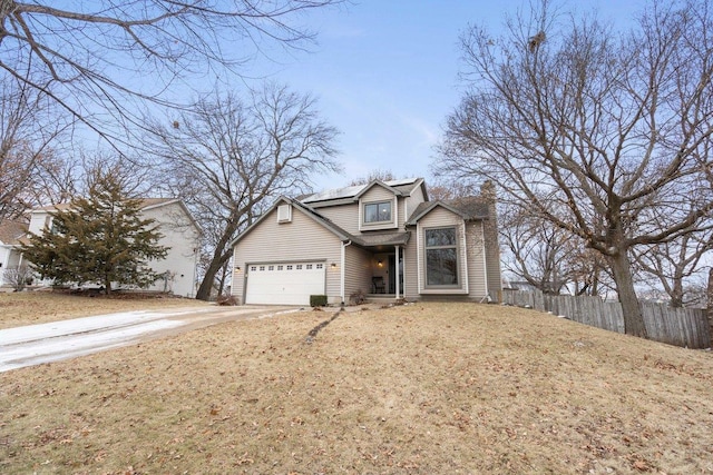 view of front facade featuring a front yard and a garage