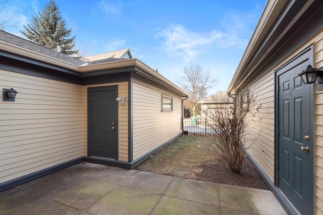 property entrance featuring a patio area