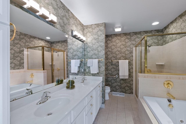 full bathroom with tile patterned floors, toilet, independent shower and bath, and vanity