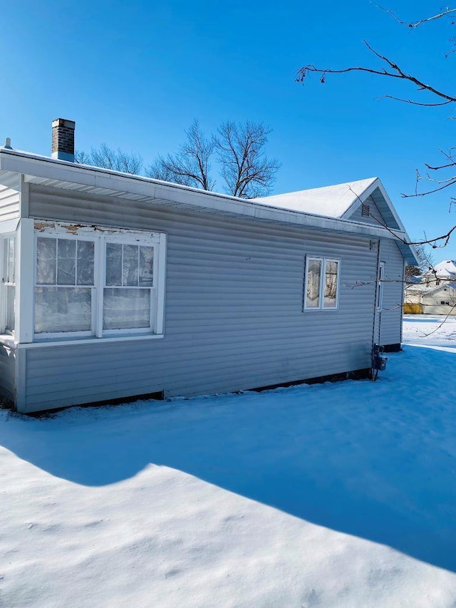 view of snow covered property