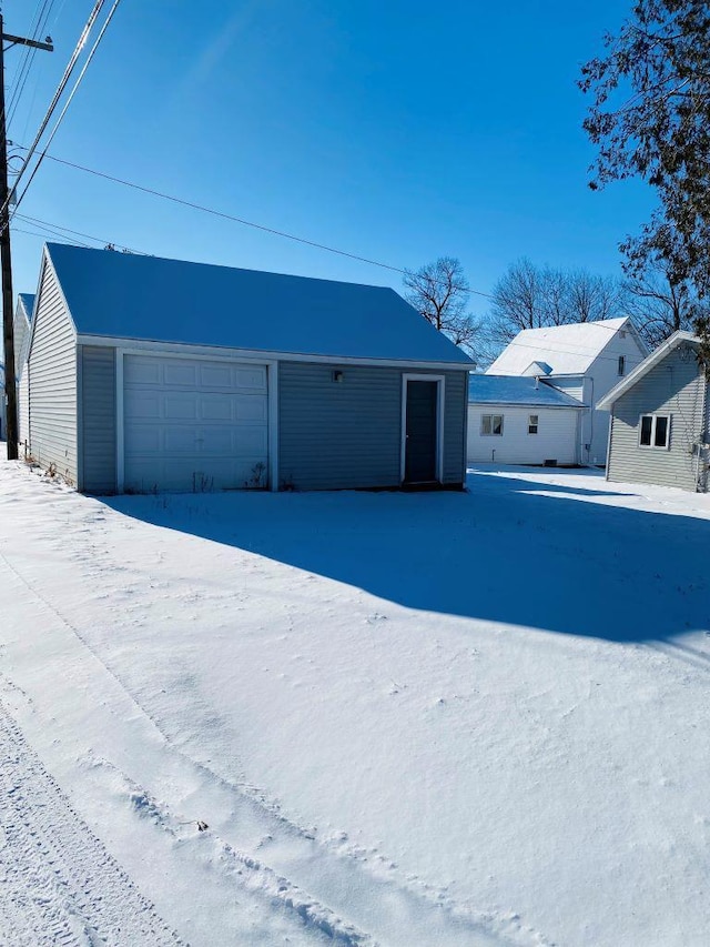 view of snow covered garage