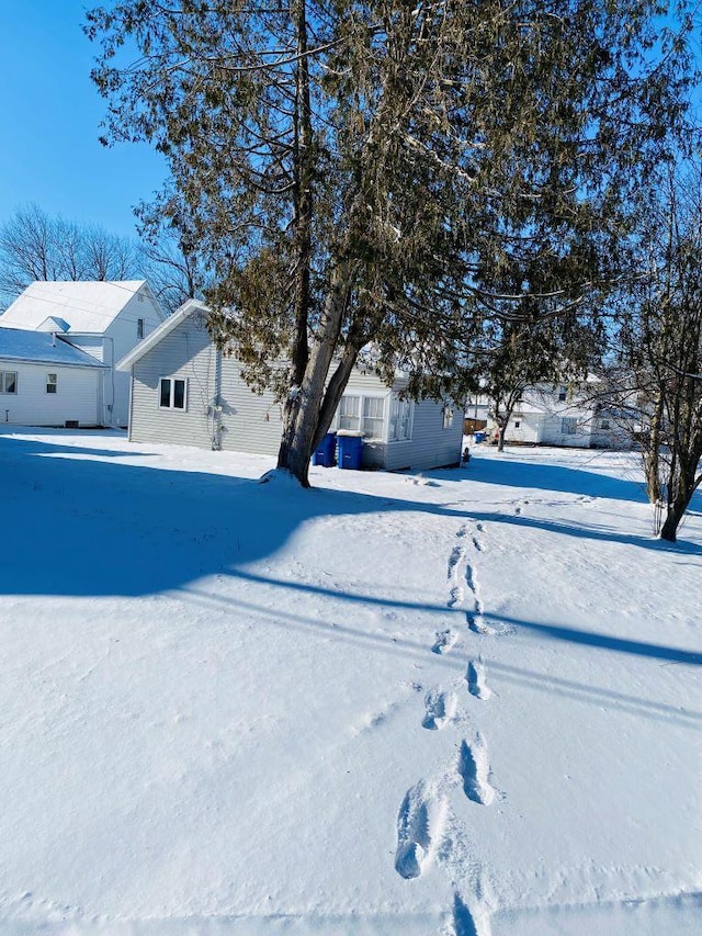 view of yard layered in snow